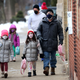 CHICAGO, ILLINOIS - JANUARY 12: Students walk to A. N. Pritzker elementary school on January 12, 2022, in Chicago, Illinois. Students in Chicago public schools are returning to school today after classes were canceled for the past six days as the city sparred with the teacher’s union over COVID-19 safety measures.